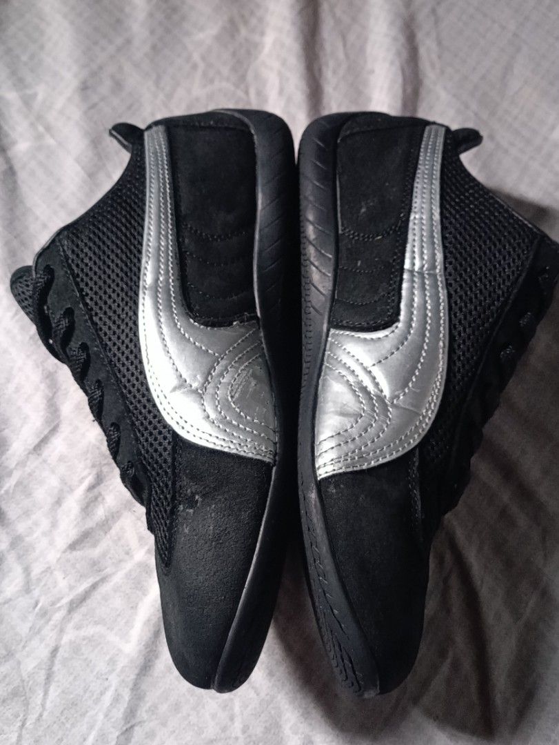 Puma Black and Silver Speedcat Sneakers (Category: Casual Shoes) located in Manila. Submitted by keenforest.c4b4c0 (Listing ID 1469866713, Image 3). Description: - Brand/Model: Black Puma low-profile driving shoes - Design: Sleek sporty style with iconic silver side stripes - Comfort: Breathable mesh panels and classic black laces - Durability: Sturdy rubber soles for daily wear - Details: Signature Puma logo on the toe and tongue area - Conditio