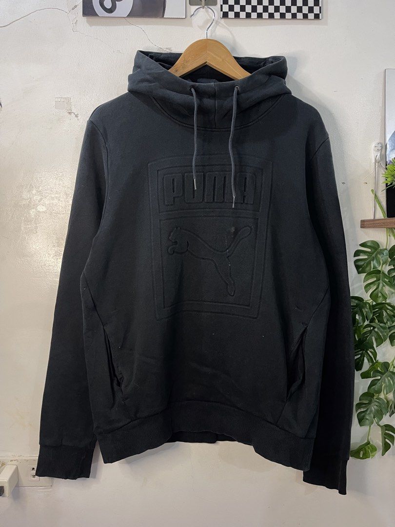 Puma Black Embossed Logo Hoodie XL (Category: Hoodies) located in Cabagan. Submitted by blessingma81004 (Listing ID 1469768521, Image 2). Description: - Brand: Puma - Color: Black - Size: XL - Features: Heavy embossed Puma logo and cat graphic, drawstring hood, front pockets, heritage tag - Style Number: 574786 - Condition: Great casual pullover with some minor dirt marks on the front near the logo.