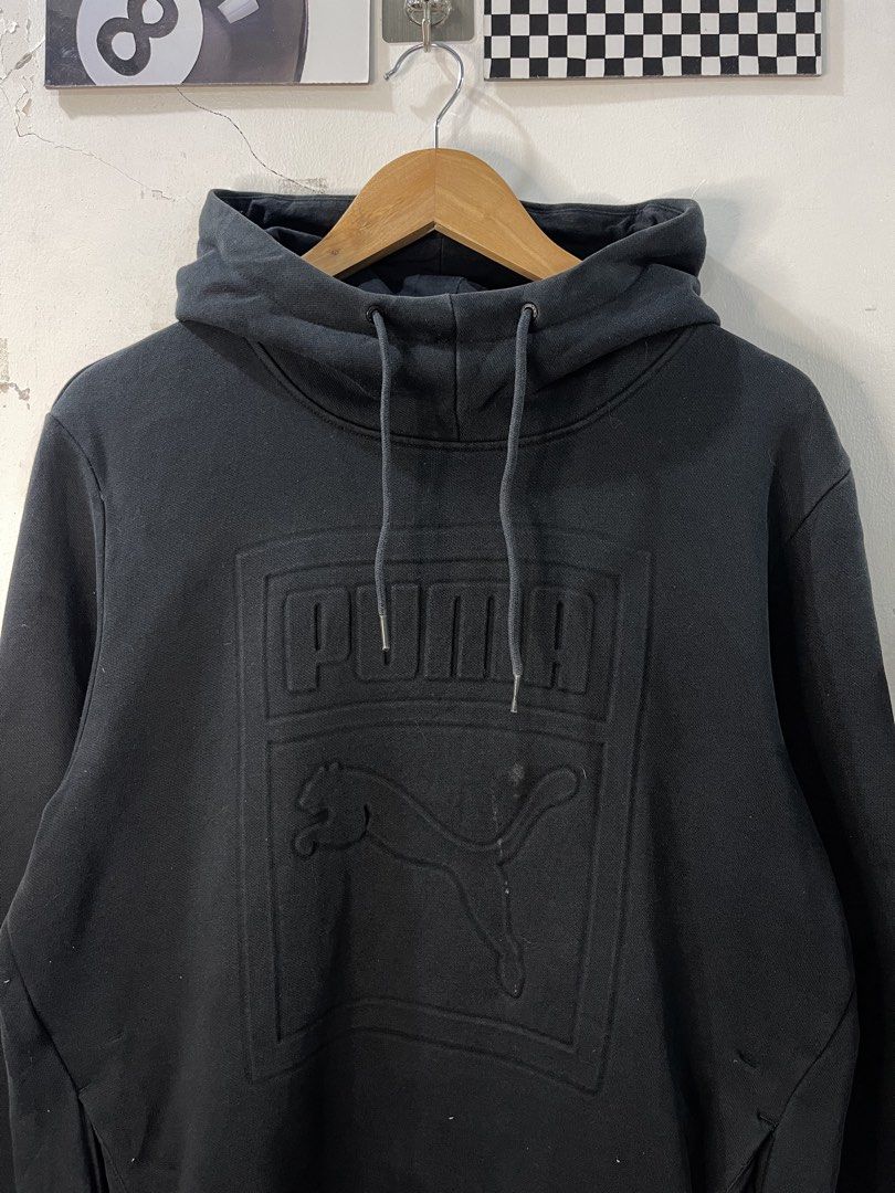 Puma Black Embossed Logo Hoodie XL (Category: Hoodies) located in Cabagan. Submitted by blessingma81004 (Listing ID 1469768521, Image 3). Description: - Brand: Puma - Color: Black - Size: XL - Features: Heavy embossed Puma logo and cat graphic, drawstring hood, front pockets, heritage tag - Style Number: 574786 - Condition: Great casual pullover with some minor dirt marks on the front near the logo.