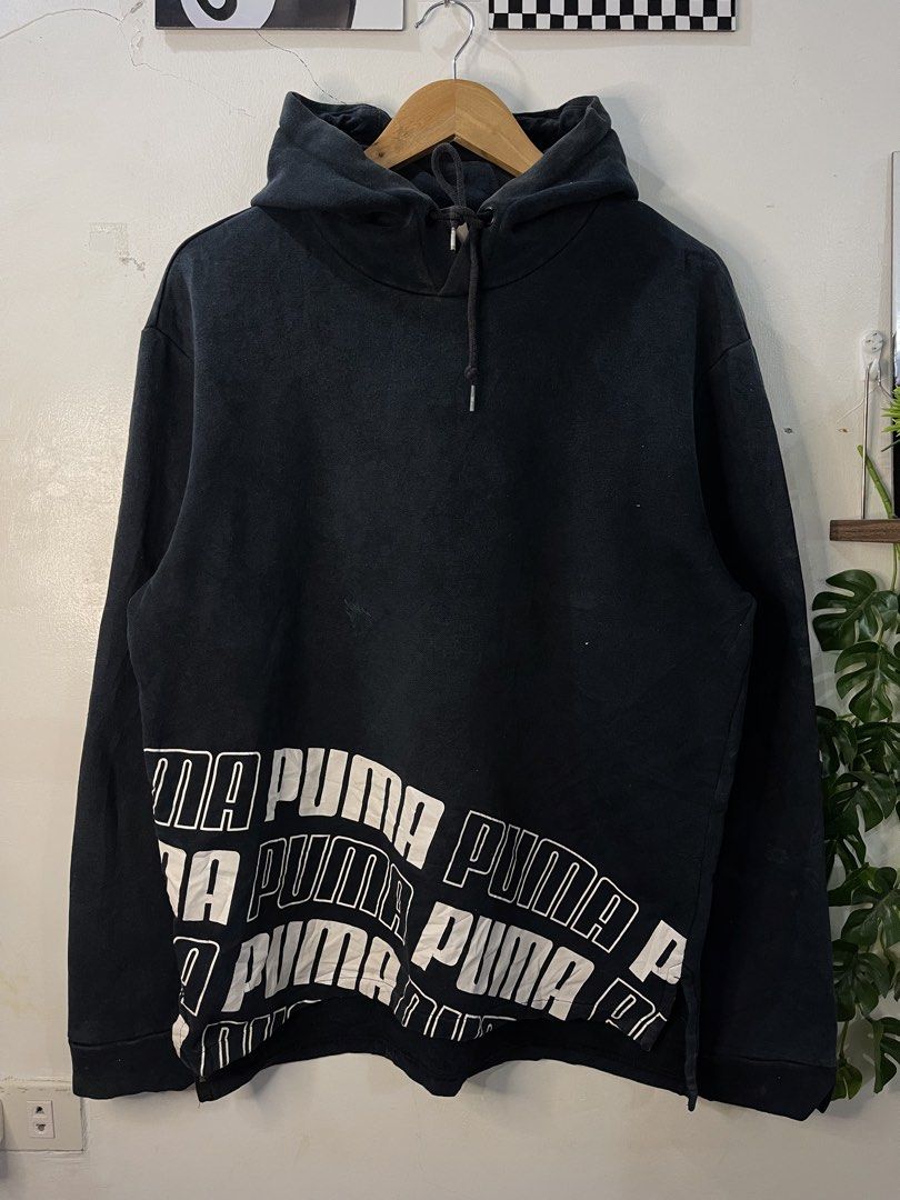 Puma Black Graphic Hoodie Size L (Category: Hoodies) located in Cabagan. Submitted by blessingma81004 (Listing ID 1469770352, Image 2). Description: Black Puma hoodie with bold white graphic text along the bottom hem. Size large tag attached. Drawstring hood, ribbed cuffs and hem. Style number 594776-01 on the inner wash tag. Has slight fading around the hoodline and needs a wash..