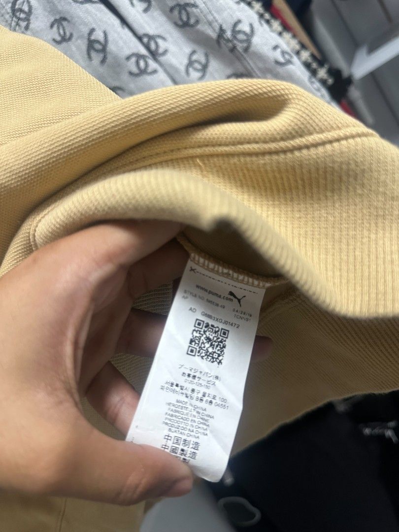 Puma x Ader Error Polo Shirt Tan Blue Size M (Category: Tshirts & Polo Shirts ) located in Manila. Submitted by rodeltzy (Listing ID 1469825536, Image 3). Description: - Brand: Puma x Ader Error - Style: Polo shirt with bright blue collar and orange piping - Color: Tan - Size: Medium (Standard US, CAN, and EUR sizing) - Material: Premium cotton pique fabric - Details: Iconic Puma leaping cat logo and Ader branding on inner collar - Authenticity: 