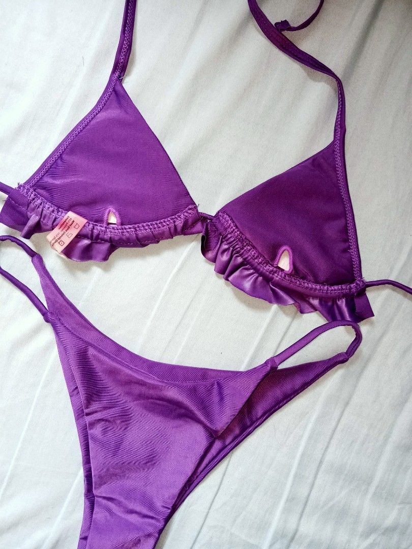 Purple Ruffle Triangle Bikini Set (Category: Bikinis & Swimsuits) located in Manila. Submitted by livelion.4e87e7 (Listing ID 1469769620, Image 3). Description: - Style: Two-piece bikini with vibrant bright purple color - Top: Triangle cut with delicate ruffle trim, adjustable halter neck, and back ties - Bottoms: Low-rise with thin side ties for a custom fit - Condition: Worn a few times, freshly washed, and ready to wear - Perfect for: Pool day