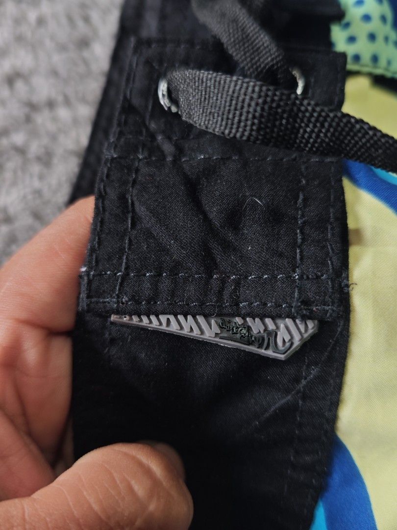 Quiksilver Board Shorts Size 30 (Category: Swim Trunks & Board Shorts) located in Dalaguete. Submitted by three7archives (Listing ID 1469829888, Image 3). Description: - Brand: Quiksilver - Size: 30 - Colorway: Blue, turquoise, and yellow with geometric and polka dot pattern - Material: 100% polyester - Closure: Drawstring with branded aglets - Extra: Small side pocket with rubber logo patch - Origin: Designed in Australia, made in China.