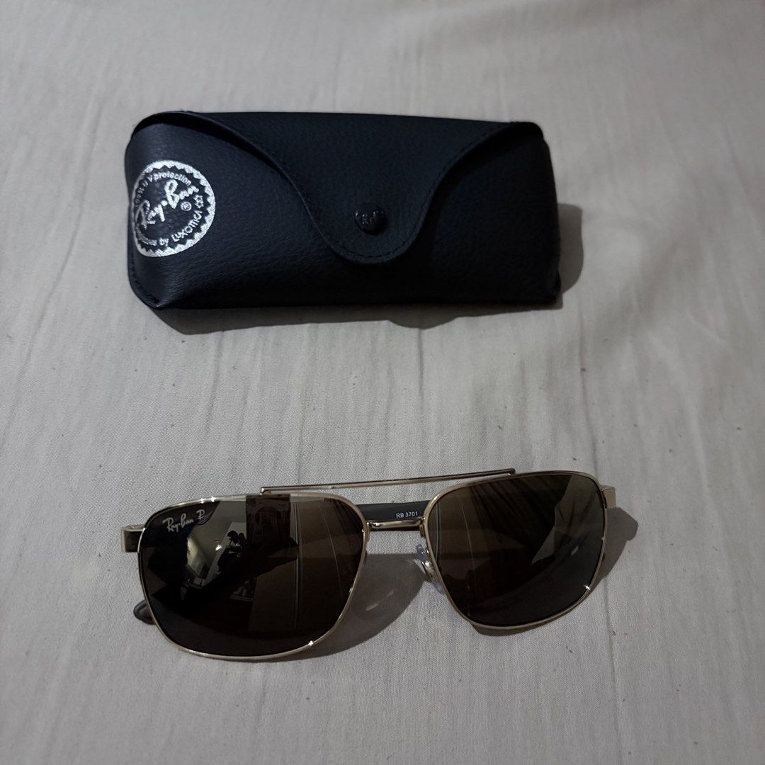 Ray-Ban RB 3701 LiteForce Polarized Sunglasses (Category: Sunglasses & Eyewear) located in Quezon City. Submitted by angelajuliet__ (Listing ID 1469920302, Image 1). Description: - Still negotiable 😊 - Brand: Ray-Ban LiteForce Polarized Sunglasses - Model: RB 3701 001/6B - Frame: Gold metal - Lenses: Brown - Size: 59-17-145 - Inclusions: Original black leatherette Ray-Ban case - Condition: Clean and well-maintained.