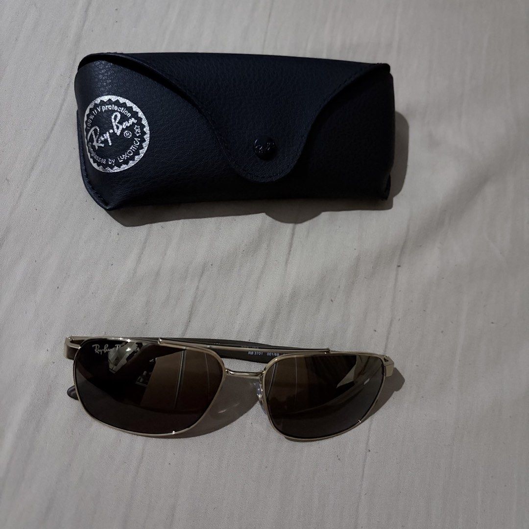 Ray-Ban RB 3701 LiteForce Polarized Sunglasses (Category: Sunglasses & Eyewear) located in Quezon City. Submitted by angelajuliet__ (Listing ID 1469920302, Image 2). Description: - Still negotiable 😊 - Brand: Ray-Ban LiteForce Polarized Sunglasses - Model: RB 3701 001/6B - Frame: Gold metal - Lenses: Brown - Size: 59-17-145 - Inclusions: Original black leatherette Ray-Ban case - Condition: Clean and well-maintained.