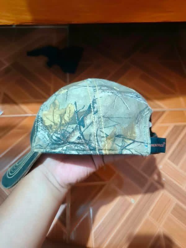REALTREE Camo Port Authority Cap (Category: Caps & Hats) located in Alaminos. Submitted by thriftings625 (Listing ID 1469938636, Image 2). Description: Waxed cotton camo cap, Evans logo Issues: Light wear, washable surface marks Kayo na magpaayos No rips, adjustable.