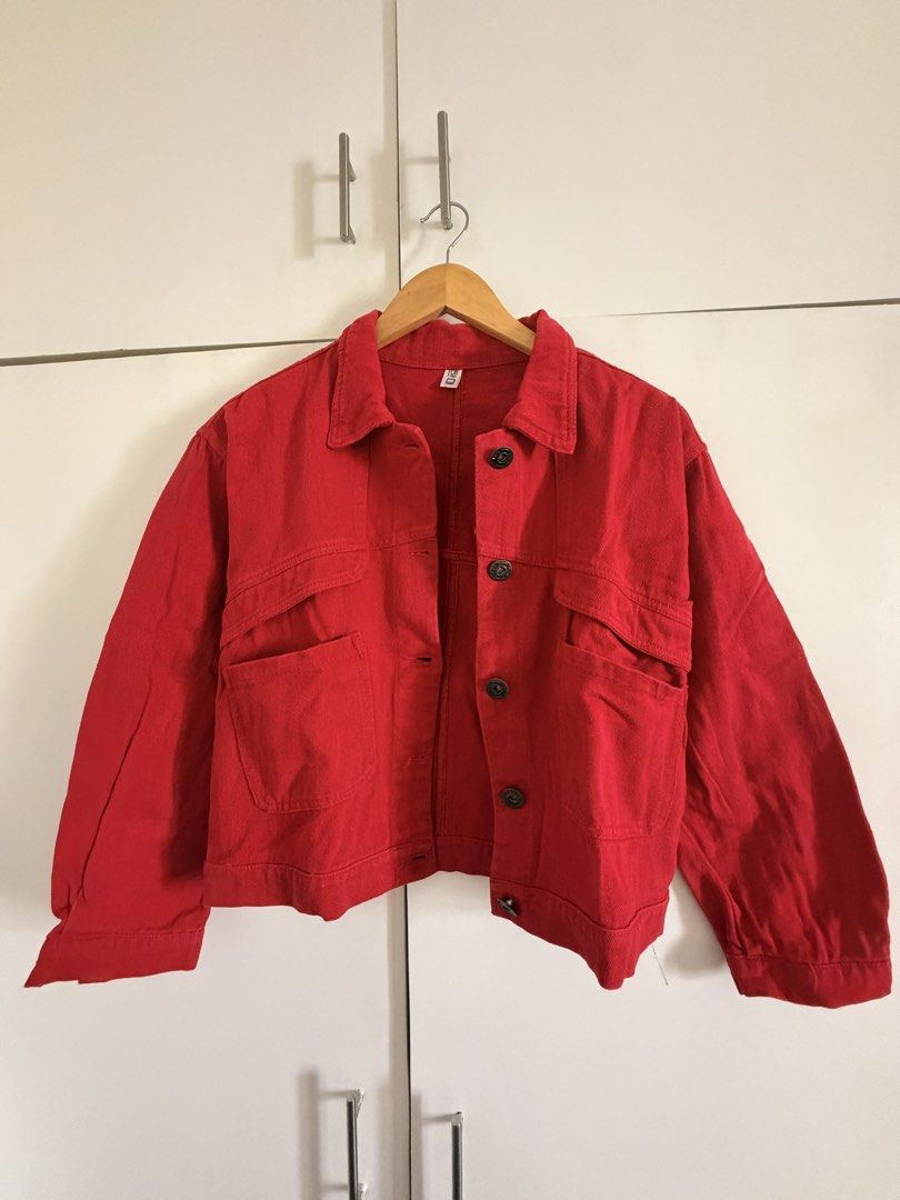 Red Denim Jacket with Front Pockets (Category: Coats, Jackets and Outerwear) located in Marikina City. Submitted by _bananahanaa (Listing ID 1469803235, Image 1). Description: - Color: Vibrant red - Material: Denim - Design: Classic collar with dark metal front buttons - Pockets: Two buttoned chest pockets and two deep lower pockets - I hand repaired a spot (refer to last two photos).