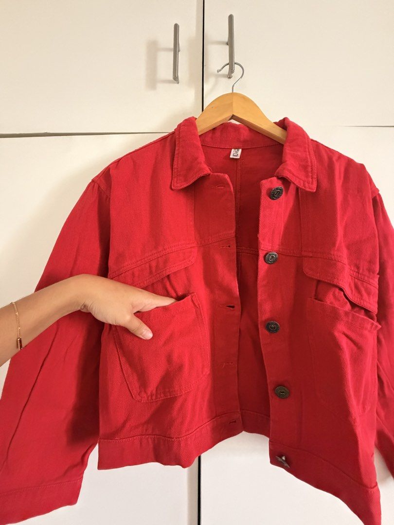 Red Denim Jacket with Front Pockets (Category: Coats, Jackets and Outerwear) located in Marikina City. Submitted by _bananahanaa (Listing ID 1469803235, Image 2). Description: - Color: Vibrant red - Material: Denim - Design: Classic collar with dark metal front buttons - Pockets: Two buttoned chest pockets and two deep lower pockets - I hand repaired a spot (refer to last two photos).