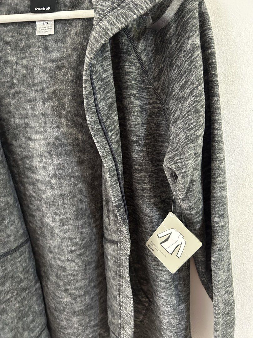 Reebok Grey Marled Zip Up Hoodie (Category: Coats, Jackets and Outerwear) located in Manila. Submitted by isabelle_1104 (Listing ID 1469919045, Image 2). Description: Large on tag but fits small to medium.
