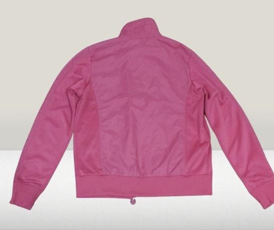 REEBOK Pink Zip-Up Track Jacket (Category: Coats, Jackets and Outerwear) located in Davao. Submitted by rosewyn (Listing ID 1469903988, Image 2). Description: - Color: Bright pink - Style: Zip-up jacket with high collar and side panel details - Fit: Ribbed cuffs and bottom hem to keep it snug - Material: Soft and comfortable - Versatility: Ideal for workouts or casual daily wear - Closure: Full front zipper with a small pull tab - Zipper (hard to