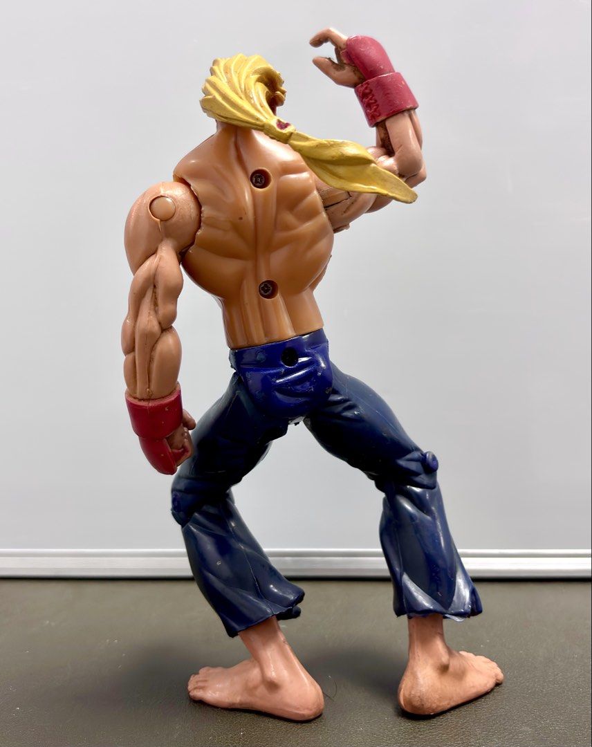 ReSaurus Street Fighter - Ken Masters (Category: Other Merchandise) located in Tarlac. Submitted by ggplaysph (Listing ID 1469805381, Image 2). Description: ReSaurus Street Fighter - Ken Masters • 350 pesos only • No markings / Loose (no box) • Glued left shoulder & with minimal paint chips • Loose waist & left shoulder • Size: 7 inches 📍COD/COP available. Shipping fee must be paid first to secure your order. Item(s) payable upon delivery/pick-u