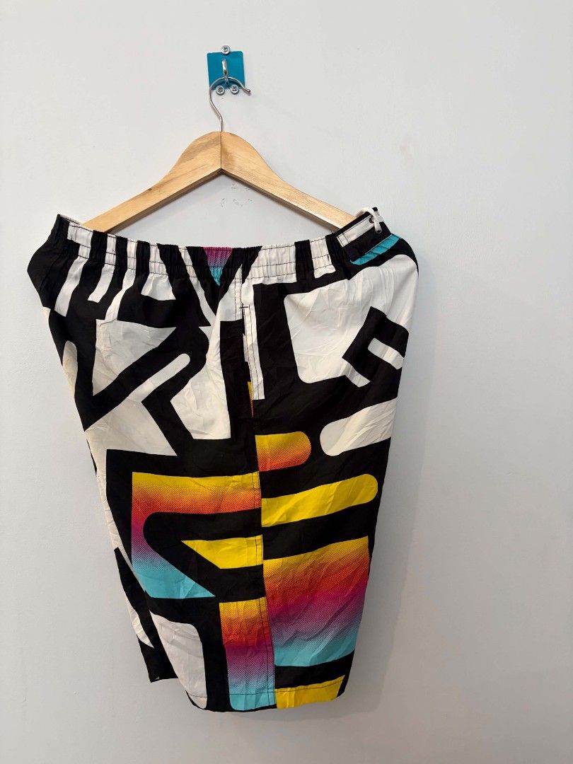Retro Abstract Print Board Shorts (Category: Swim Trunks & Board Shorts) located in Manila. Submitted by gregorioju41138 (Listing ID 1469837501, Image 2). Description: - Eye-catching bold abstract print with vibrant neon gradients - Geometric shapes in black, white, yellow, cyan, and magenta - Elastic waistband with adjustable drawstring for a secure fit - Lightweight fabric ideal for swimming or beach days - Super comfortable fit with a retro st