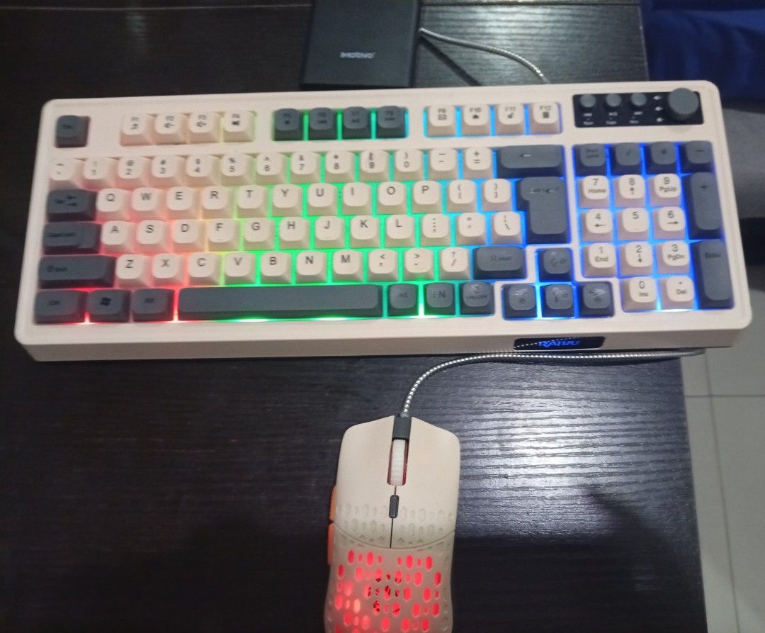 Retro beige mechanical keyboard and honeycomb mouse set (Category: Computer Keyboard) located in Makati City. Submitted by warm.berniekahn (Listing ID 1469899531, Image 2). Description: - Retro mechanical keyboard and matching honeycomb gaming mouse bundle - Durable silver braided cables for both wired devices - Keyboard features a full numeric keypad and top-right multimedia knobs - Customizable RGB backlighting across all keys and mouse body - 