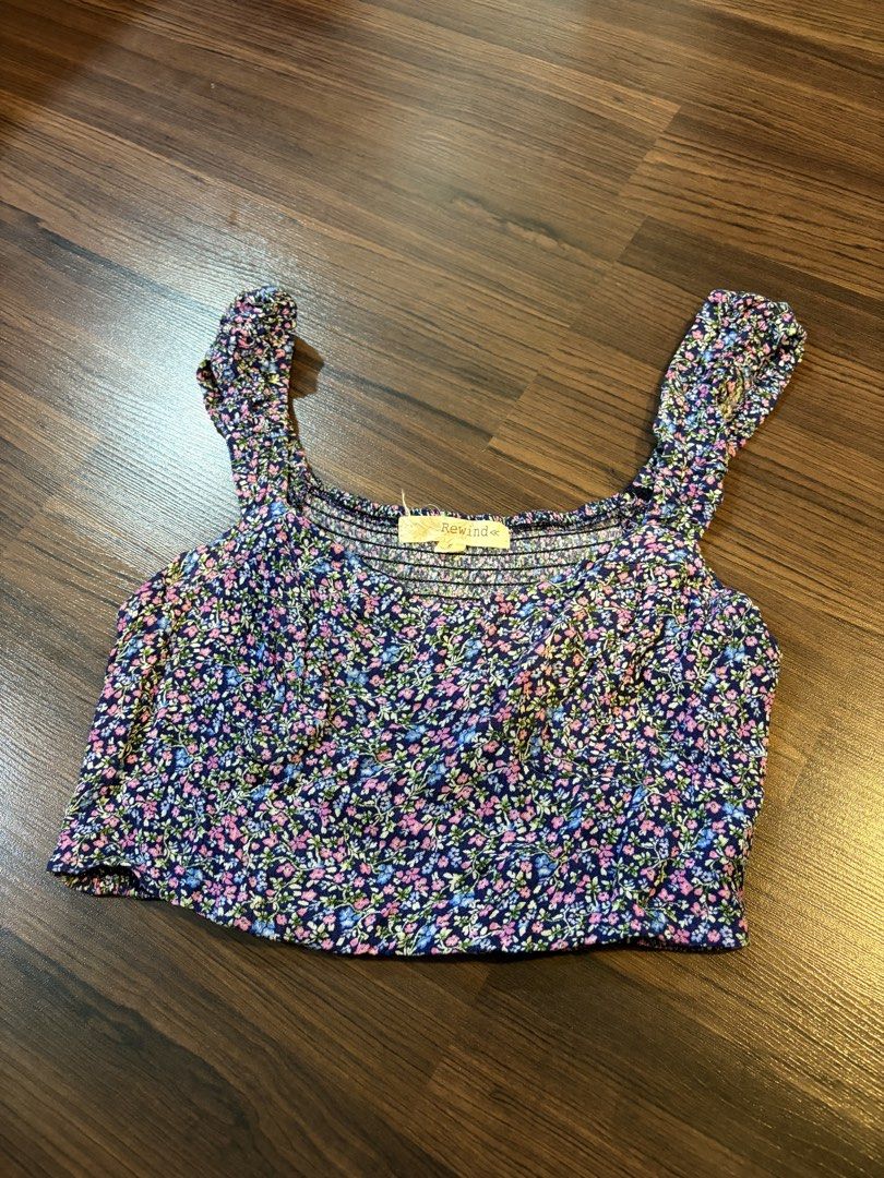 Rewind Floral Crop Top (Category: Sleeveless) located in Paranaque City. Submitted by trendyclothesco (Listing ID 1469845975, Image 2). Description: - Brand: Rewind - Size: Small - Design: Purple floral print with sweetheart neckline and wide straps - Condition: Worn once only - bought in Hawaii for $15.