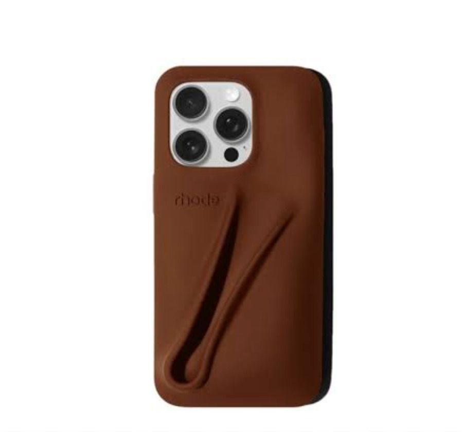 RHODE | IPhone 14 Pro Max Lip Case in Bronze (Category: Cases & Sleeves) located in Makati City. Submitted by _rentorbuy (Listing ID 1469797216, Image 1). Description: - Brand: RHODE - Compatible Model: iPhone 14 Pro Max - Color: Bronze (Matches Espresso Peptide Lip Tint) - Material: Soft-touch, durable silicone - Special Feature: Built-in back compartment designed to hold lip balm or lip tint securely perfect for everyday use and easy on-the-go 