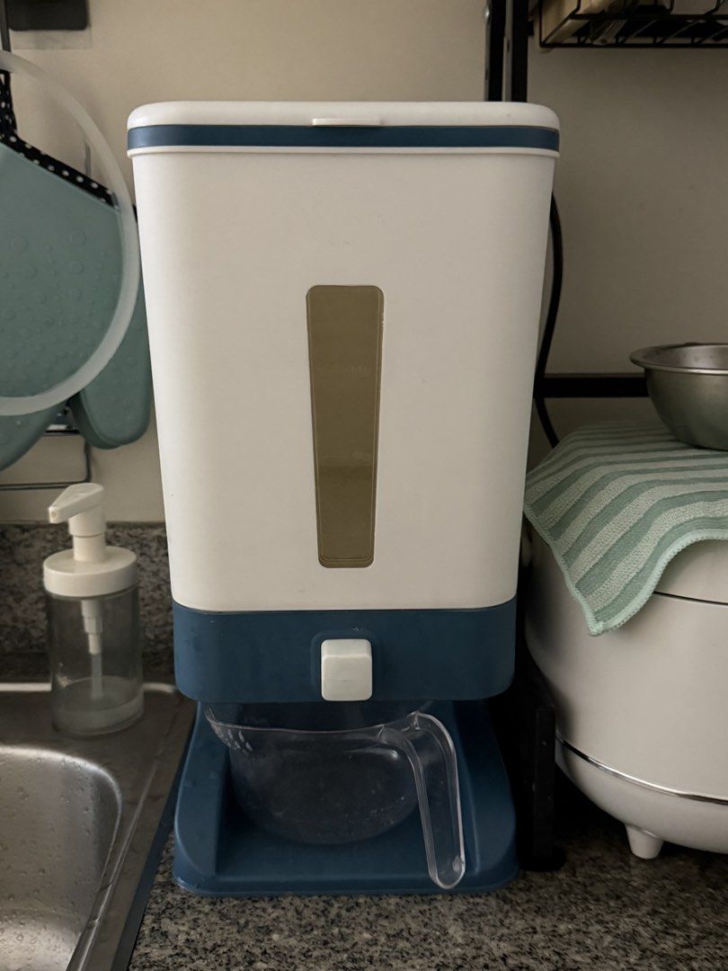 Rice Dispenser 10kg Capacity Storage Container (Category: Food Organization & Storage) located in Bulacan. Submitted by chewieeee_ (Listing ID 1469931400, Image 1). Description: - Capacity: Holds up to 10kg of rice - Condition: Used but clean and works perfectly.