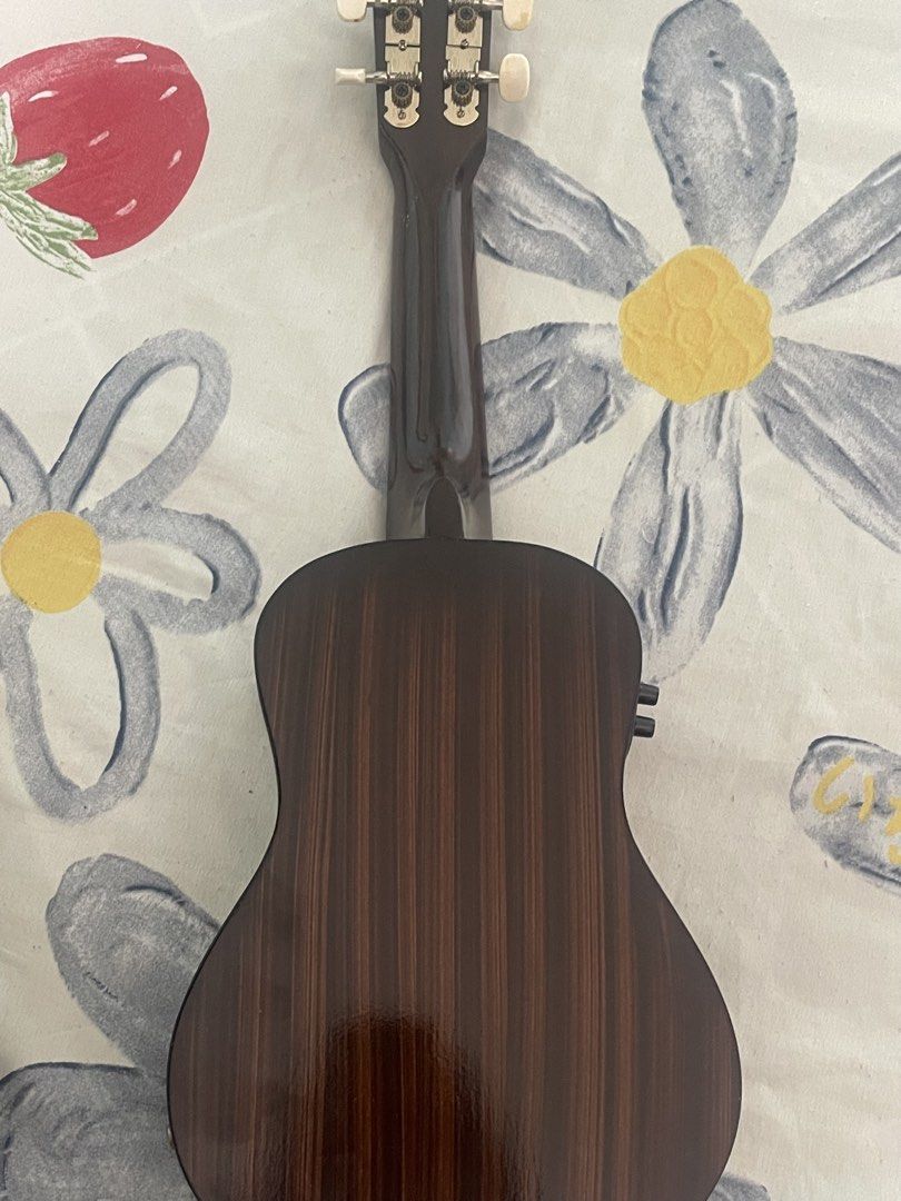 RJ Red Acoustic Ukulele with Gig Bag (Category: Musical Instruments) located in Pasig City. Submitted by declutternsale28 (Listing ID 1469801320, Image 3). Description: Not used. Gift given rfs: not use at home - Brand/Model: RJ acoustic-electric ukulele - Color: Striking red finish with elegant dark wood back and sides - Electronics: Built-in controls on the side for easy amplification - Condition: Clean body and neck, ready to play - Inclusion: