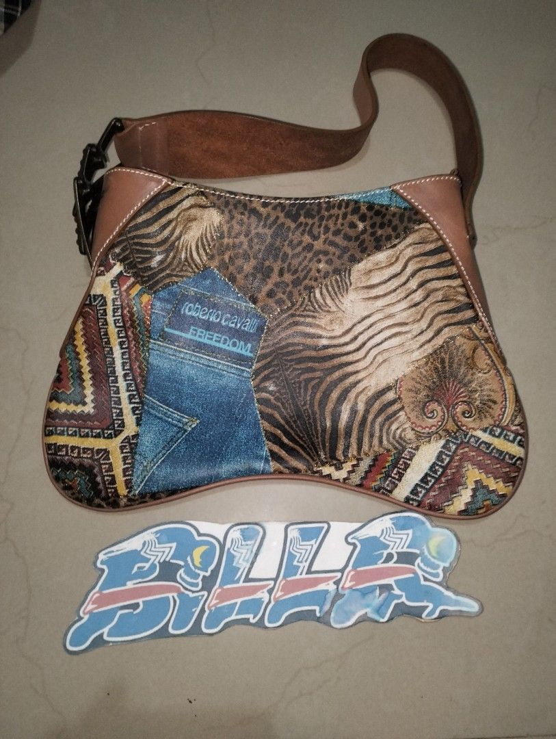Roberto Cavalli (Category: Shoulder Bags) located in Apalit. Submitted by thrift.nkie.bills (Listing ID 1469773126, Image 1). Description: Gud day Sir/Madam 🥳 For SALE 🔥 For SALE 🔥 For SALE 🔥 🥳 Roberto Cavalli 🔥 Description: Rank AB or B Vintage Roberto Cavalli (collection year 1998) shoulder bag total leather with ethnic and boho chic elements. The handle is leather and the main body is suede leather. This rare Roberto Cavalli piece is a m