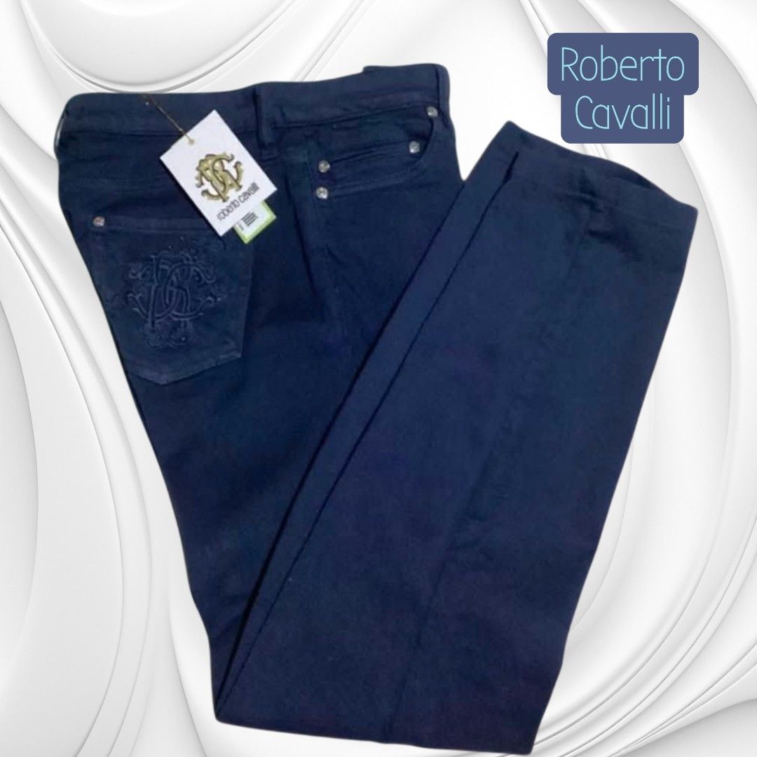 Roberto Cavalli Dark Blue Denim Jeans (Category: Jeans) located in Paranaque City. Submitted by calm_youngstore7 (Listing ID 1469880333, Image 3). Description: - Brand: Roberto Cavalli - Condition: Brand new with tags (BNWT) - Color: Dark blue - Fit: Straight leg - Style: Classic five-pocket design with embellished back pockets - Details: Branded hardware and button closure - Material: Premium Italian designer denim - Perfect for elevating your c