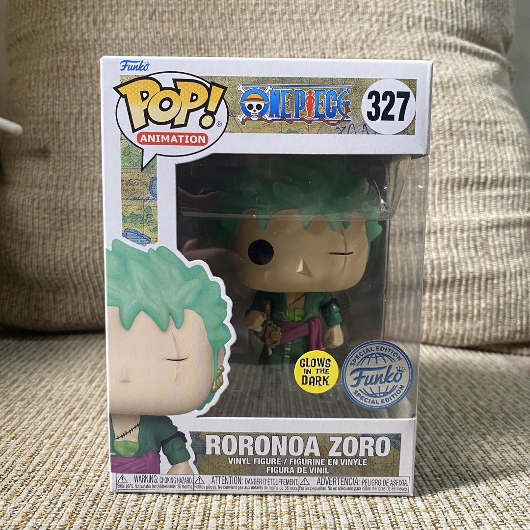 Roronoa Zoro Funko Pop (Category: Designer & Blind Box Toys) located in Paranaque City. Submitted by ddaveduave01162 (Listing ID 1469901384, Image 1). Description: - Character: Roronoa Zoro (#327) from One Piece - Special Feature: Glow-in-the-dark with Special Edition sticker - Design details: Green hair, green outfit, and iconic eye scar - Condition: Box is intact with a clear plastic front window - Perfect for: Anime fans and Funko Pop collecto