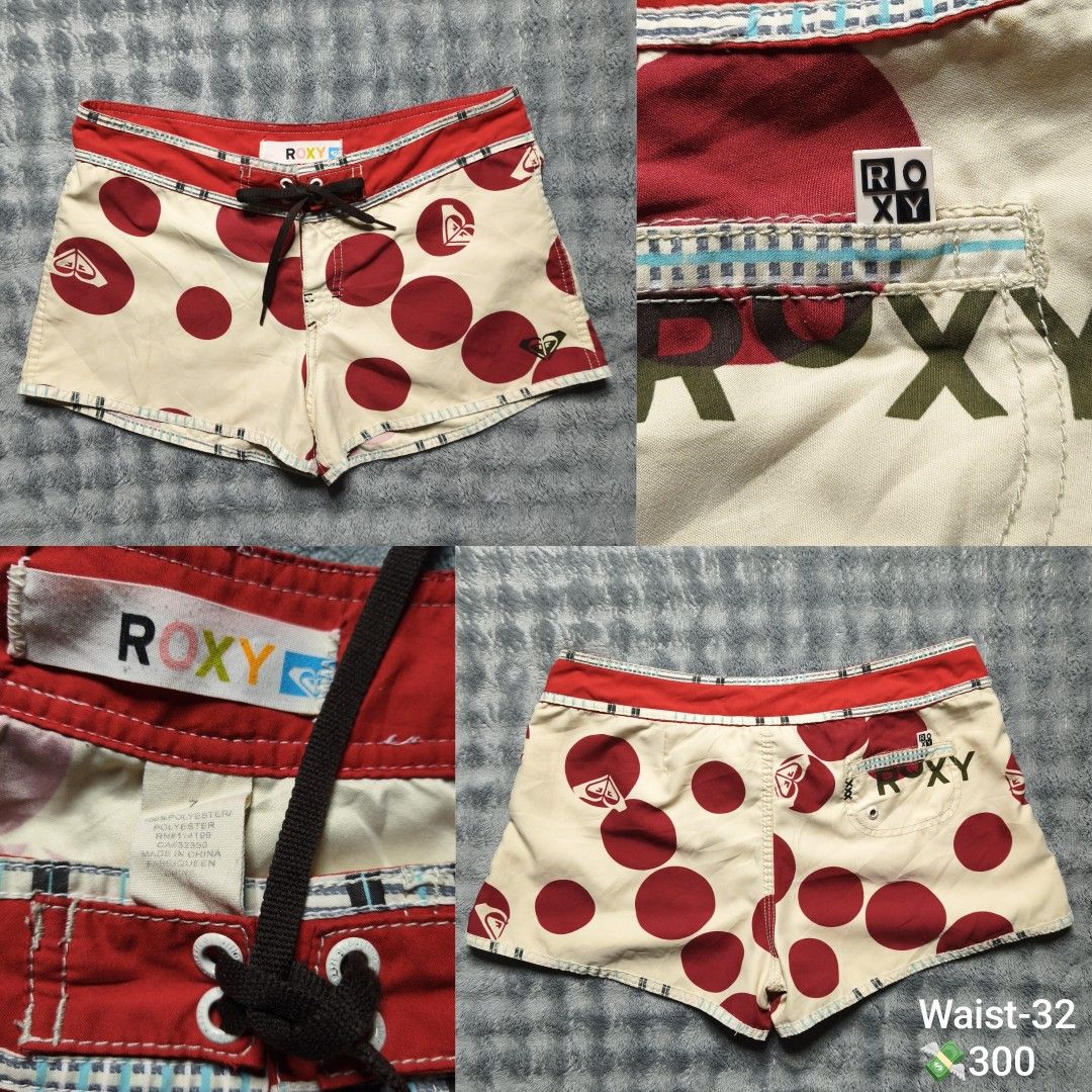 Roxy Red White Polka Dot Boardshorts Size 7 (Category: Swim Trunks & Board Shorts) located in Floridablanca. Submitted by vintager12 (Listing ID 1469866883, Image 1). Description: - Brand: Roxy - Style: Boardshorts in cream with bold red polka dots - Waistband: Red with dark brown lace-up drawstring closure - Details: Small back pocket with rubber Roxy tab and large printed Roxy logo on the back - Size: Tag size 7 - Material: 100% polyester - Ori