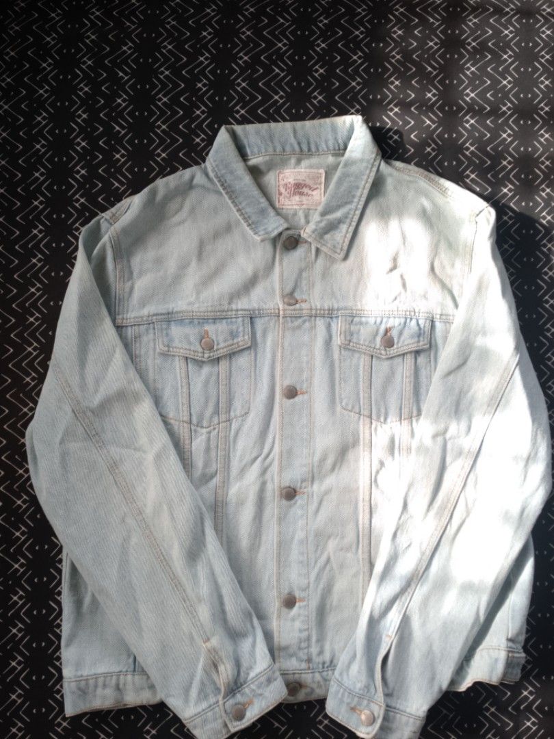Rugged House Light Wash Denim Jacket 3XL (Category: Coats, Jackets and Outerwear) located in Bacolod City. Submitted by surfwear_in_negros (Listing ID 1469946077, Image 3). Description: - Brand: Rugged House - Style: Classic denim trucker jacket - Color: Light blue wash - Size: 3XL - Features: Button-up front, branded metal hardware, dual chest flap pockets, structured collar, contrast stitching - Material: Durable denim - Care: Machine wash cold