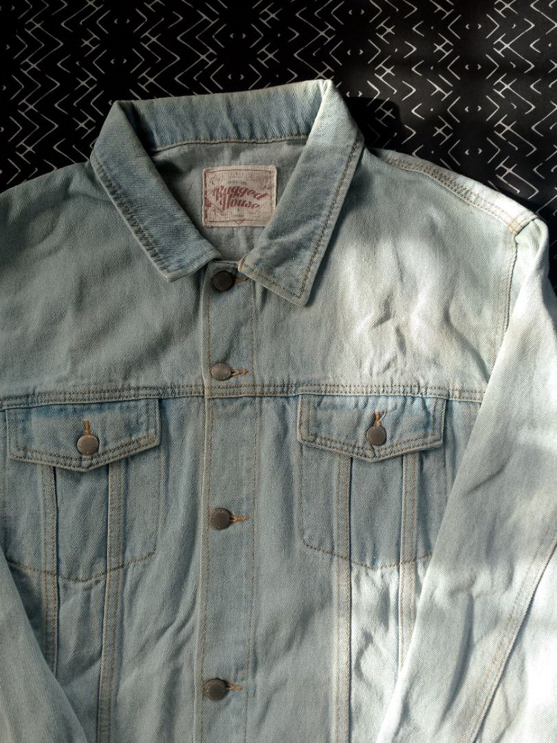 Rugged House Light Wash Denim Jacket 3XL (Category: Coats, Jackets and Outerwear) located in Bacolod City. Submitted by surfwear_in_negros (Listing ID 1469946077, Image 2). Description: - Brand: Rugged House - Style: Classic denim trucker jacket - Color: Light blue wash - Size: 3XL - Features: Button-up front, branded metal hardware, dual chest flap pockets, structured collar, contrast stitching - Material: Durable denim - Care: Machine wash cold