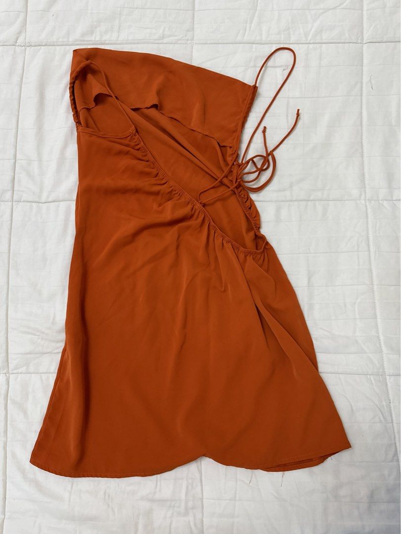 Rust Orange Cowl Neck Mini Dress with Tie Back (Category: Dresses) located in Quezon City. Submitted by m3gan8 (Listing ID 1469787879, Image 2). Description: Rust orange mini dress. Cowl neckline in the front, low open back with delicate adjustable straps that tie at the side. Lightweight material, great flow. Short cut, sits above the knee. No tags attached, never worn out..