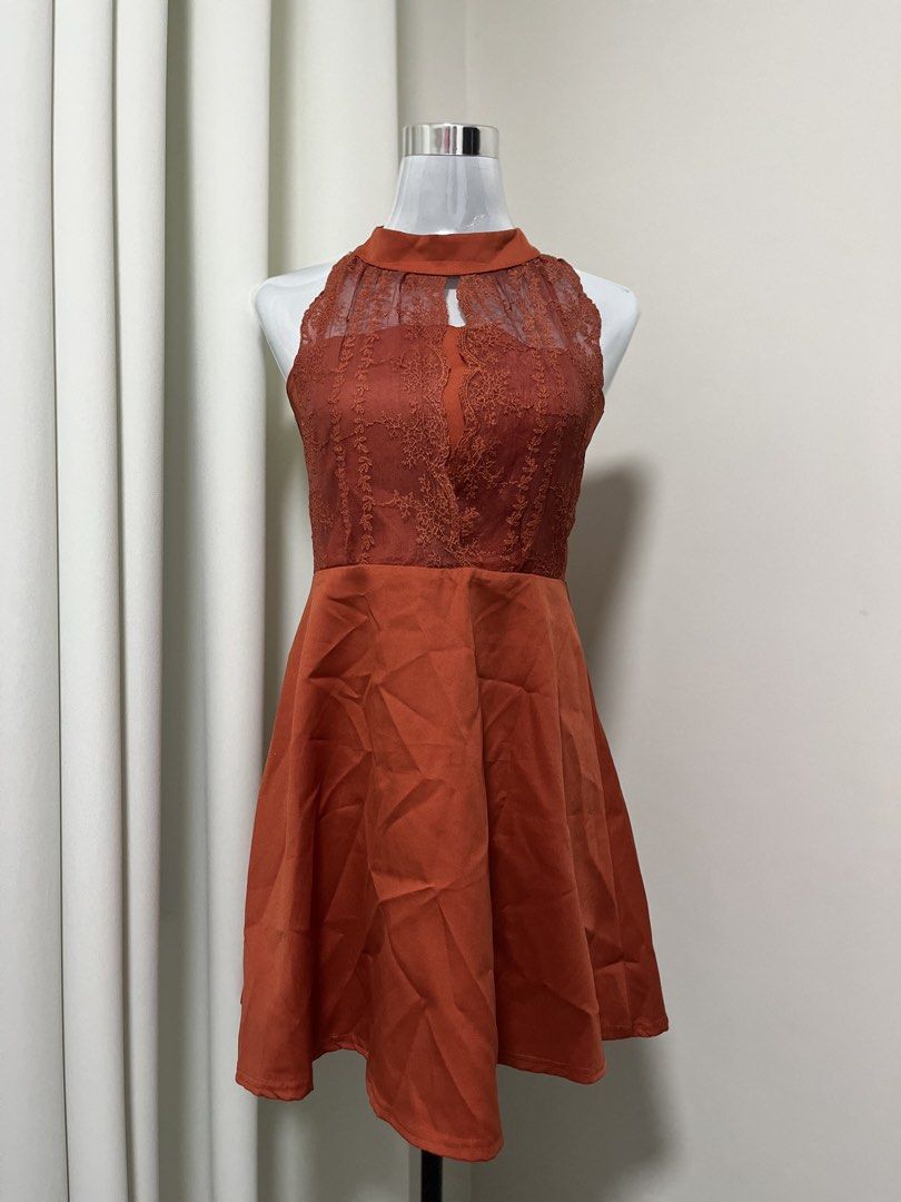 Rust Orange Halter Neck Lace Panel Cocktail Dress (Category: Dresses) located in Angeles City. Submitted by pinkpool (Listing ID 1469769729, Image 1). Description: - Color: Stunning rust orange - Design: Halter neckline with a chic front keyhole cutout - Bodice: Sheer lace overlay with intricate floral embroidery - Skirt: Flared A-line satin skirt with a fitted waist - Length: Midi to above-knee - Closure: Clean, hidden back zipper - Occasion: Id