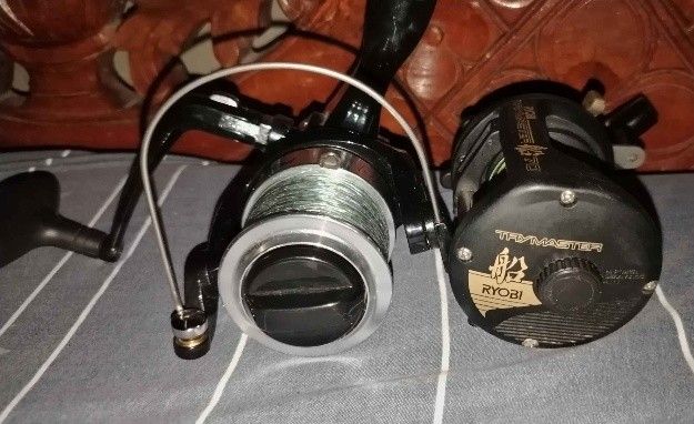 Ryobi Trymaster 70 and Spinning Reel Bundle (Category: Fishing) located in Manila. Submitted by mharkdgbuy42140 (Listing ID 1469841165, Image 2). Description: - Fishing reel bundle (selling as a set) - Item 1: Ryobi Trymaster 70 overhead boat reel loaded with multi-colored braided line - Item 2: Black spinning reel spooled with green line - Condition: Shows light wear from past trips, but both spin very smoothly - Ideal beginner setup for saltwat