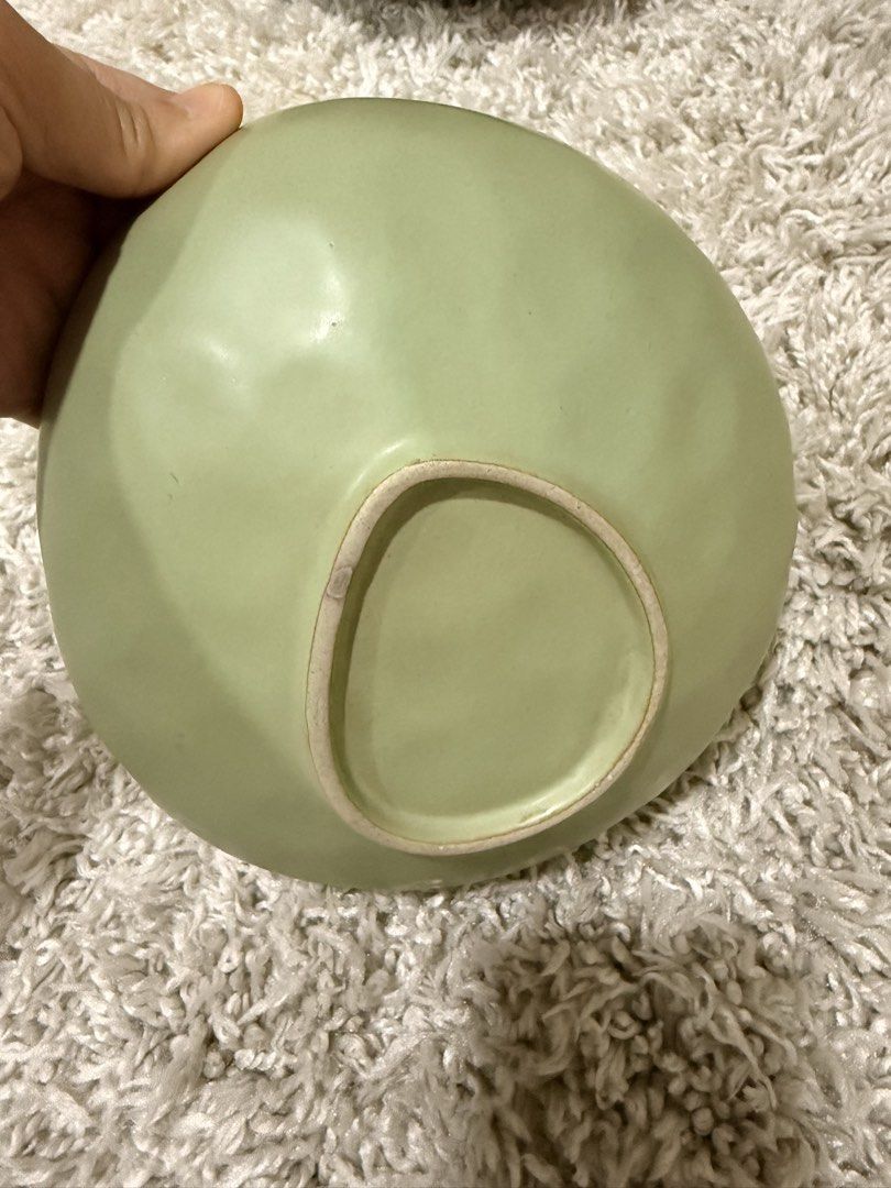 Sage Green Ceramic Serving Bowl Organic Shape (Category: Dinnerware & Cutlery) located in Mandaluyong City. Submitted by riz_040521 (Listing ID 1469797520, Image 2). Description: - Color: Sage green - Material: Solid stoneware - Finish: Smooth matte interior, slightly textured exterior - Design: Organic wavy shape with a raised foot base - Versatility: Ideal for soups, salads, and snacks - Aesthetic: Perfect for minimalist table settings.
