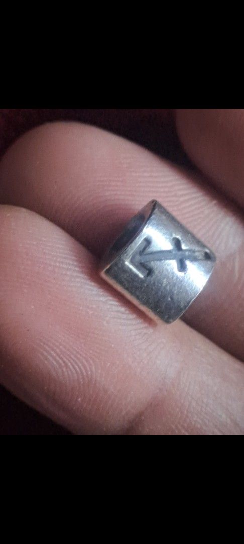Sagittarius Zodiac Charm Bead Silver (Category: Charms) located in Davao. Submitted by bravemoon_556cd5 (Listing ID 1469834049, Image 1). Description: - Item: Silver-tone bead charm - Design: Sagittarius arrow symbol engraved - Details: Stamped markings near inner hole, solid metal - Compatibility: Great for charm bracelets or necklaces - Condition: Good, with minor signs of wear.