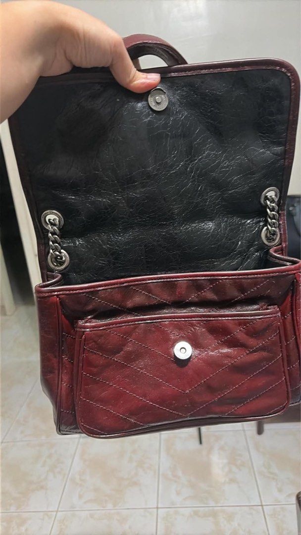 Saint Laurent Niki Medium Chain Bag Burgundy (Category: Luxury Bags & Wallets) located in Caloocan City. Submitted by theprelovedpurse (Listing ID 1469880985, Image 3). Description: - Brand: Saint Laurent (YSL) Niki Shoulder Bag - Color/Material: Deep burgundy crinkled leather with dark metallic hardware - Design: Quilted chevron stitching with signature matching YSL front monogram - Compartments: Spacious interior layout with a convenient front 