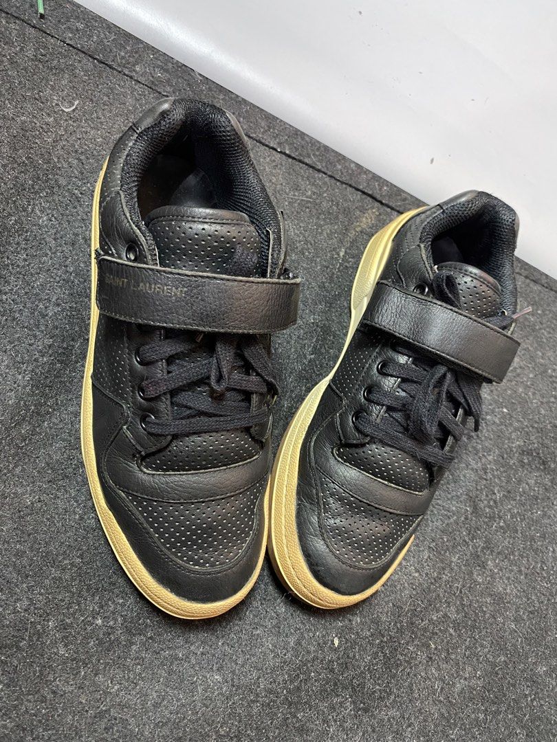 Saint Laurent Paris Low Top Age Sneakers (Category: Sneakers) located in Quezon City. Submitted by loloyz123 (Listing ID 1469916167, Image 2). Description: Saint Laurent Paris Low Top Age Sneakers Condition: Very good Color rate: 8/10 Color: Black/ Leather Size: 40 Insole: 26 cm.