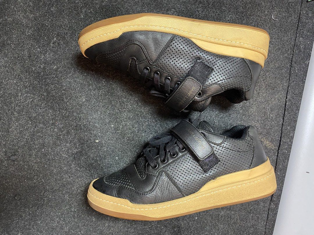 Saint Laurent Paris Low Top Age Sneakers (Category: Sneakers) located in Quezon City. Submitted by loloyz123 (Listing ID 1469916167, Image 3). Description: Saint Laurent Paris Low Top Age Sneakers Condition: Very good Color rate: 8/10 Color: Black/ Leather Size: 40 Insole: 26 cm.
