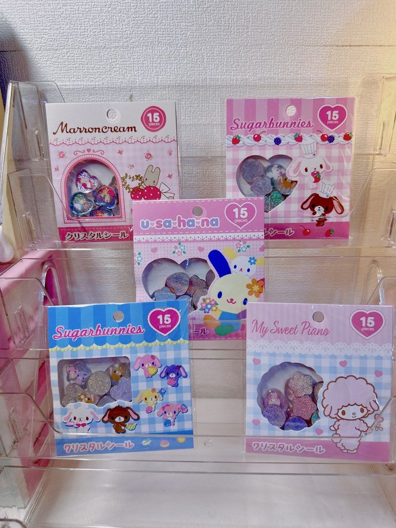Sanrio Crystal Glitter Stickers (Category: Character Goods) located in Manila. Submitted by ronoarabbit.ph (Listing ID 1469931926, Image 1). Description: ❗️350 each❗️ ✔️Marroncream, ✔️Sugarbunnies Pink ✔️Sugarbunnies Blue ✔️Usahana ✔️My Sweet Piano - 15 glittery pieces per pack featuring adorable heart shapes and character faces - Perfect for journaling, decoden, or Sanrio collectors!.
