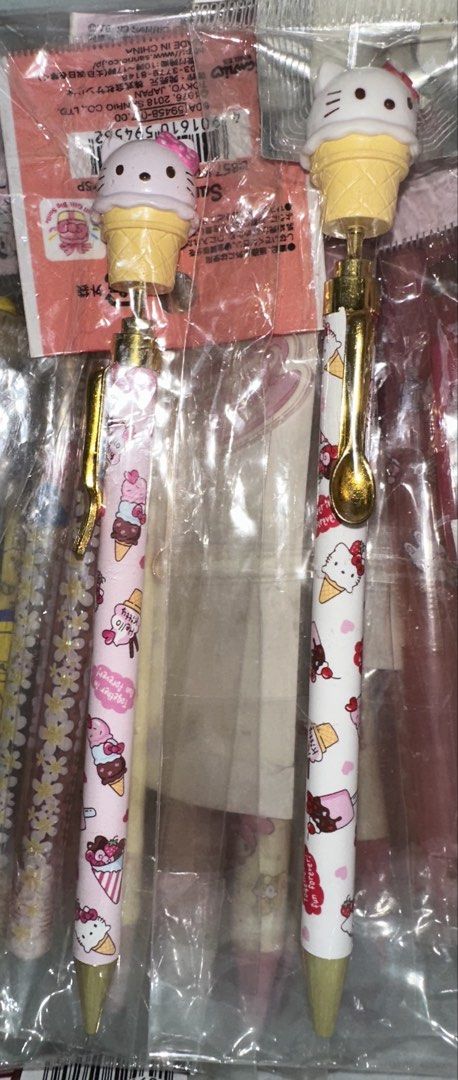 Sanrio Hello Kitty Ice Cream Cone Ballpoint Pen (Category: Stationery & School Supplies) located in Quezon City. Submitted by mitchapple88 (Listing ID 1469835174, Image 1). Description: - Set of 2 Sanrio Kitty ballpoint pens - Adorable pink and white ice cream cone design - Features a 3D Kitty head sitting on an ice cream cone topper - Chic gold-tone spoon clip detail - Brand new in original plastic packaging - Great for daily use, school, journa