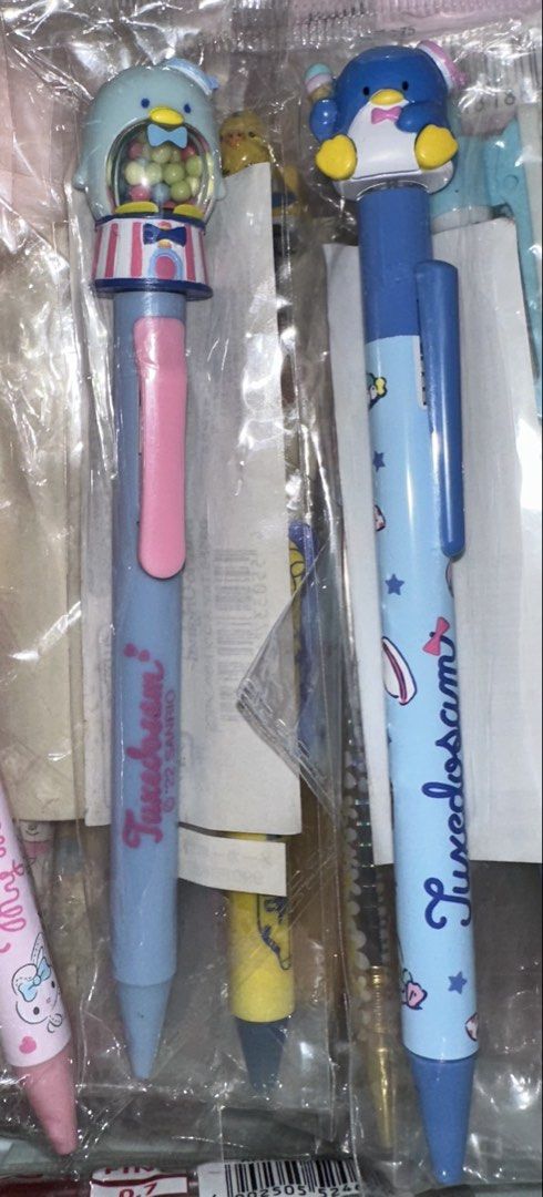 Sanrio Tuxedosam Character Pens Set (Category: Stationery & School Supplies) located in Quezon City. Submitted by mitchapple88 (Listing ID 1469835273, Image 1). Description: - Set of 2 brand new, factory-sealed Sanrio Tuxedosam pens - Pen 1: Adorable gumball machine topper design - Pen 2: Cute Tuxedosam figurine holding an ice cream cone with blue printed barrel graphics - Authentic merchandise with Sanrio 2022 copyright markings - Great gift ide