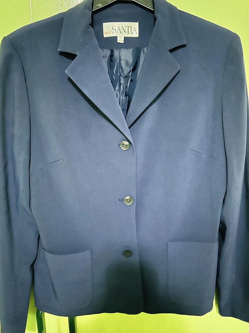 Santia Blue Blazer Jacket Size XL (Category: Coats, Jackets and Outerwear) located in Pasig City. Submitted by nananana29 (Listing ID 1469825837, Image 1). Description: - Brand: Santia - Color: Navy Blue - Size: XL (True to size) - Material/Lining: Fully lined with matching dark blue satin - Closure & Pockets: Three front buttons with two lower patch pockets - Details: Lapel collar, clean back with central seam - Style: Ideal for officewear and s