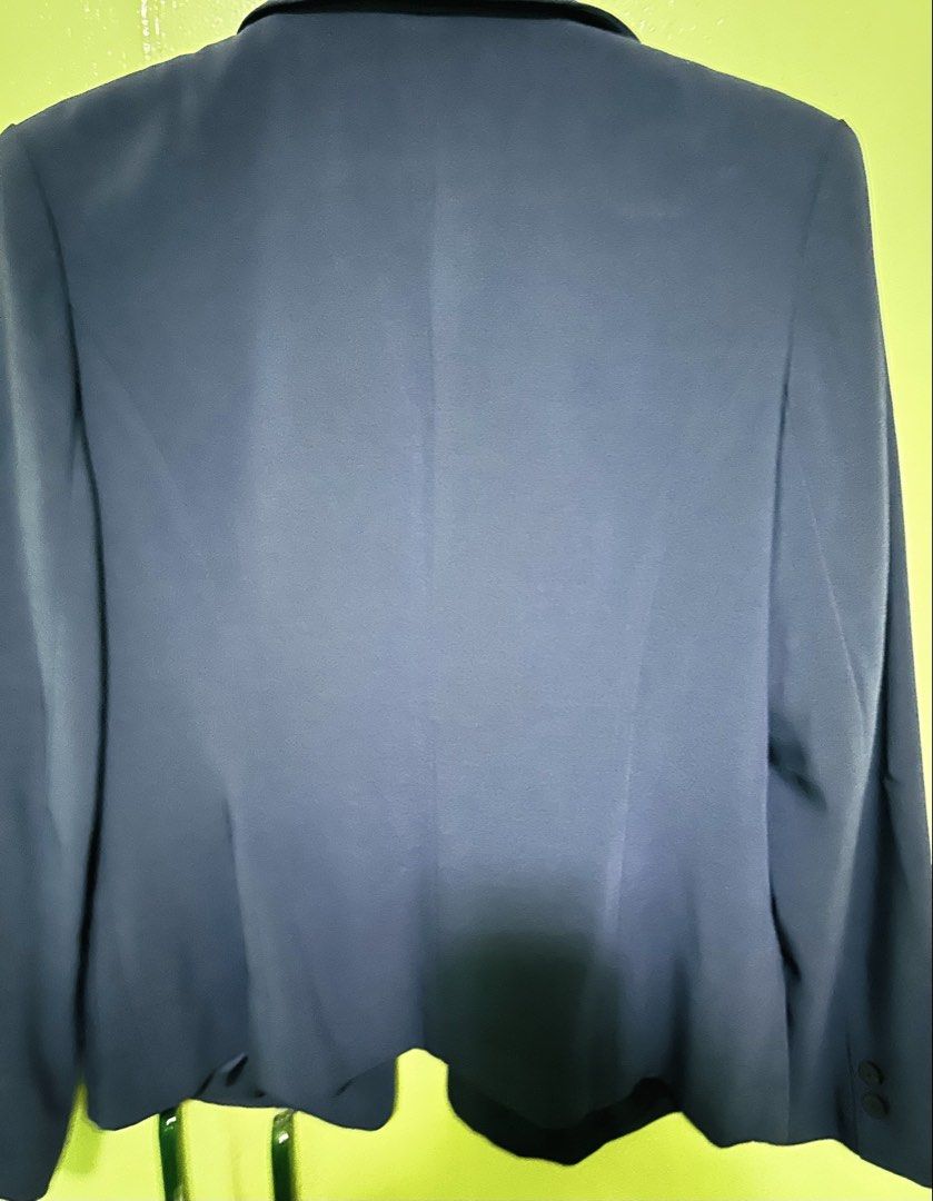 Santia Blue Blazer Jacket Size XL (Category: Coats, Jackets and Outerwear) located in Pasig City. Submitted by nananana29 (Listing ID 1469825837, Image 3). Description: - Brand: Santia - Color: Navy Blue - Size: XL (True to size) - Material/Lining: Fully lined with matching dark blue satin - Closure & Pockets: Three front buttons with two lower patch pockets - Details: Lapel collar, clean back with central seam - Style: Ideal for officewear and s