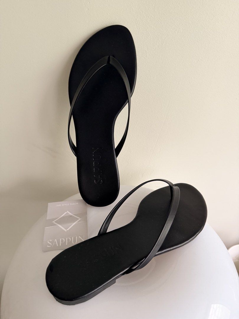 SAPPUN Black Thong Flat Sandals (240mm) (Category: Flats & Sandals) located in Paranaque City. Submitted by inmycloset08 (Listing ID 1469777246, Image 3). Description: Trendy minimalist thong sandals with thin straps and flat soles, very comfy. Worn once, still in perfect condition, clean overall - Rfs: I bought a smaller size 🌸via same day lalamove pick up only .
