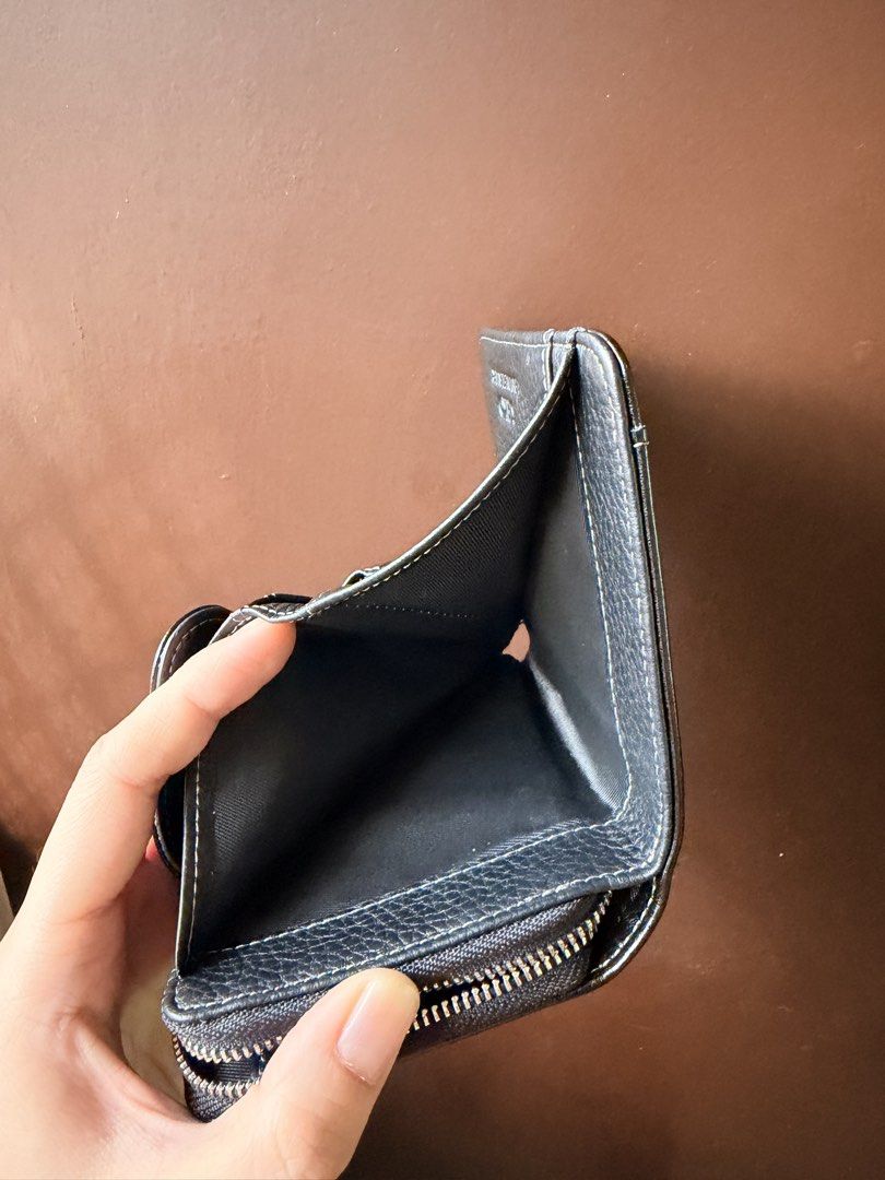 Seiko Black Genuine Leather RFID Wallet (Category: Wallets & Card Holders) located in Batangas. Submitted by intyl_preloved.bags (Listing ID 1469944933, Image 3). Description: - Genuine black leather with stylish white stitching details - Built-in RFID blocking technology to keep your cards secure - Multiple card slots, spacious cash compartment, and zipped coin pocket - Handcrafted finish for a premium look and feel - Comes complete with origina