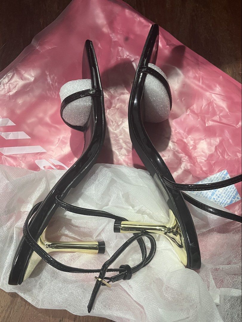 SHEIN Black Strappy Kitten Heels Size 9 (Category: Heels) located in Caloocan City. Submitted by gerlie1531 (Listing ID 1469749393, Image 2). Description: - Brand: SHEIN - Condition: Brand new, never worn (protective foam still on toe strap) - Size: US 9 / EUR 40 - Design: Black strappy heels with modern square toe - Heel: Eye-catching metallic gold stiletto - Closure: Thin adjustable ankle strap.