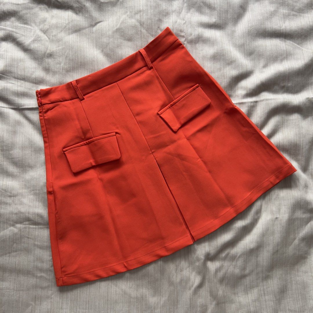 Evolushein Bright Orange Mini Skirt (Category: Skirts) located in Pasig City. Submitted by jenscloset86 (Listing ID 1469823806, Image 1). Description: Brand: SHEIN (evolushein) Size: SMALL Color: Bright Orange/ Red Orange • BRAND NEW (but washed once). • Never used, never worn. • No flaws, no damages. Measurement: Length: 17” Waist: 27” Hip: 39” .
