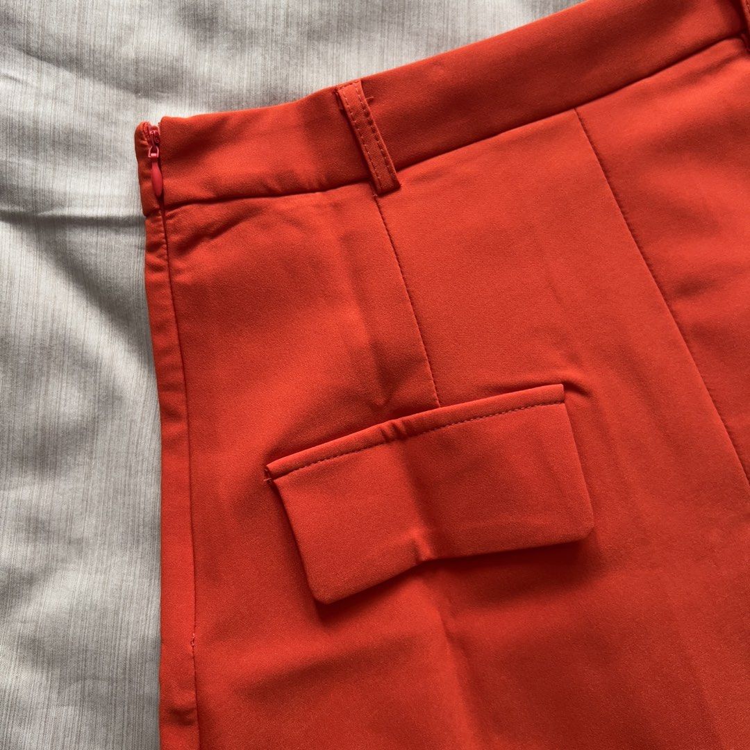Evolushein Bright Orange Mini Skirt (Category: Skirts) located in Pasig City. Submitted by jenscloset86 (Listing ID 1469823806, Image 3). Description: Brand: SHEIN (evolushein) Size: SMALL Color: Bright Orange/ Red Orange • BRAND NEW (but washed once). • Never used, never worn. • No flaws, no damages. Measurement: Length: 17” Waist: 27” Hip: 39” .