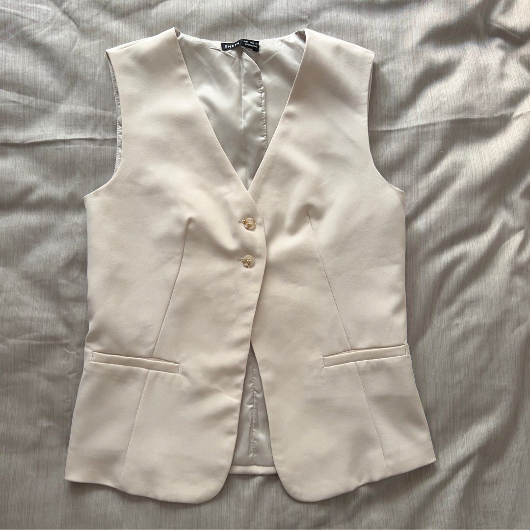 SHEIN Cream Tailored Vest Size S (Category: Sleeveless) located in Pasig City. Submitted by jenscloset86 (Listing ID 1469892218, Image 1). Description: Brand: SHEIN Size: Small • Used TWICE. Looks new. • Excellent quality. • No flaws, no damages. Dimension: Length: 24.5” Bust: 34” Waist: 34”.