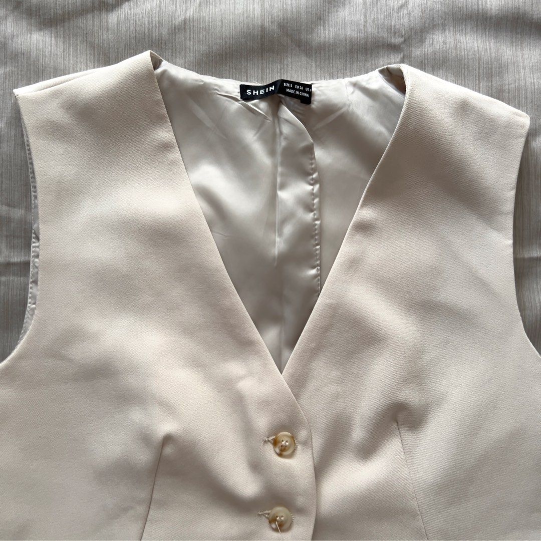 SHEIN Cream Tailored Vest Size S (Category: Sleeveless) located in Pasig City. Submitted by jenscloset86 (Listing ID 1469892218, Image 3). Description: Brand: SHEIN Size: Small • Used TWICE. Looks new. • Excellent quality. • No flaws, no damages. Dimension: Length: 24.5” Bust: 34” Waist: 34”.