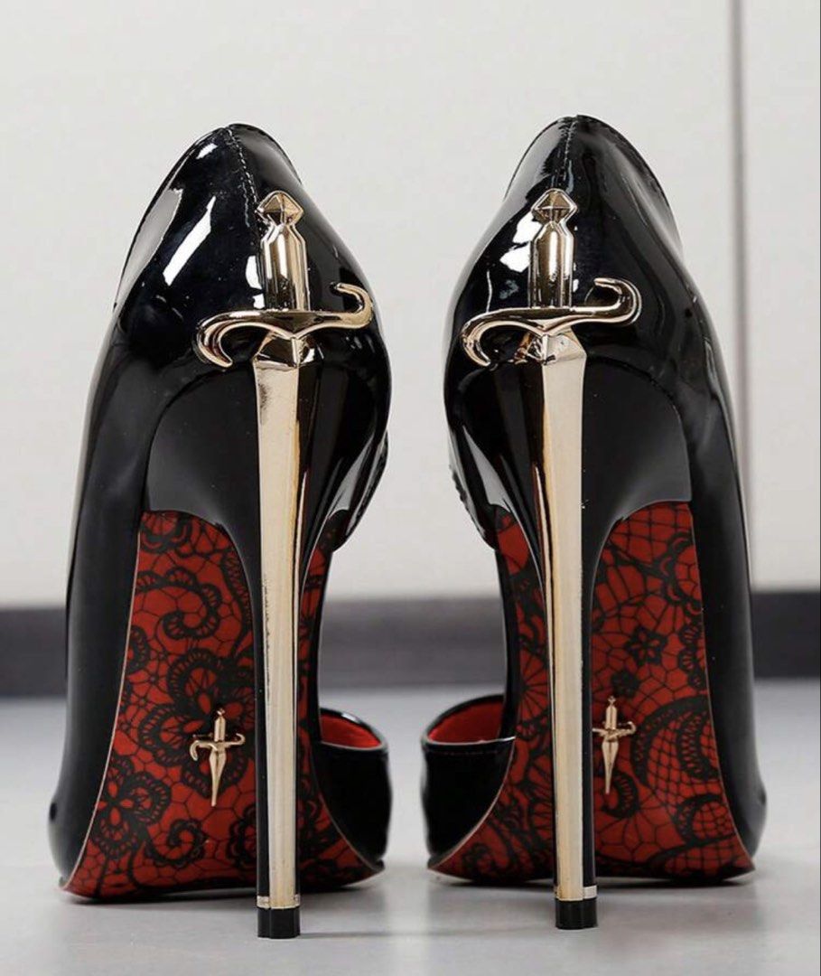 Shein Dagger/Sword stiletto heels cesare paccioti style (Category: Heels) located in Makati City. Submitted by maxgomez (Listing ID 1469787262, Image 1). Description: - Glossy black patent finish with a sleek pointed-toe design - Eye-catching gold dagger-shaped stiletto heel on the back - Signature red sole featuring a chic black lace print and tiny dagger emblem - Convenient slip-on style for easy wear - Perfect statement shoes for parties, even