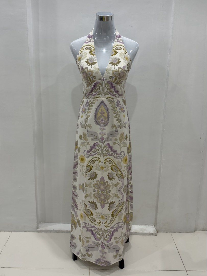 SHEIN Floral Halter Neck Maxi Dress with Open Back (Category: Dresses) located in Mandaluyong City. Submitted by jaimierouu (Listing ID 1469876310, Image 1). Description: Cream background maxi dress with purple and olive green floral and paisley print all over. Deep V-neckline with halter neck strap. Back features cutouts and adjustable tie straps. Long length, slim fit through the bodice, flowing down to the hem. Hidden zipper closure at the bac