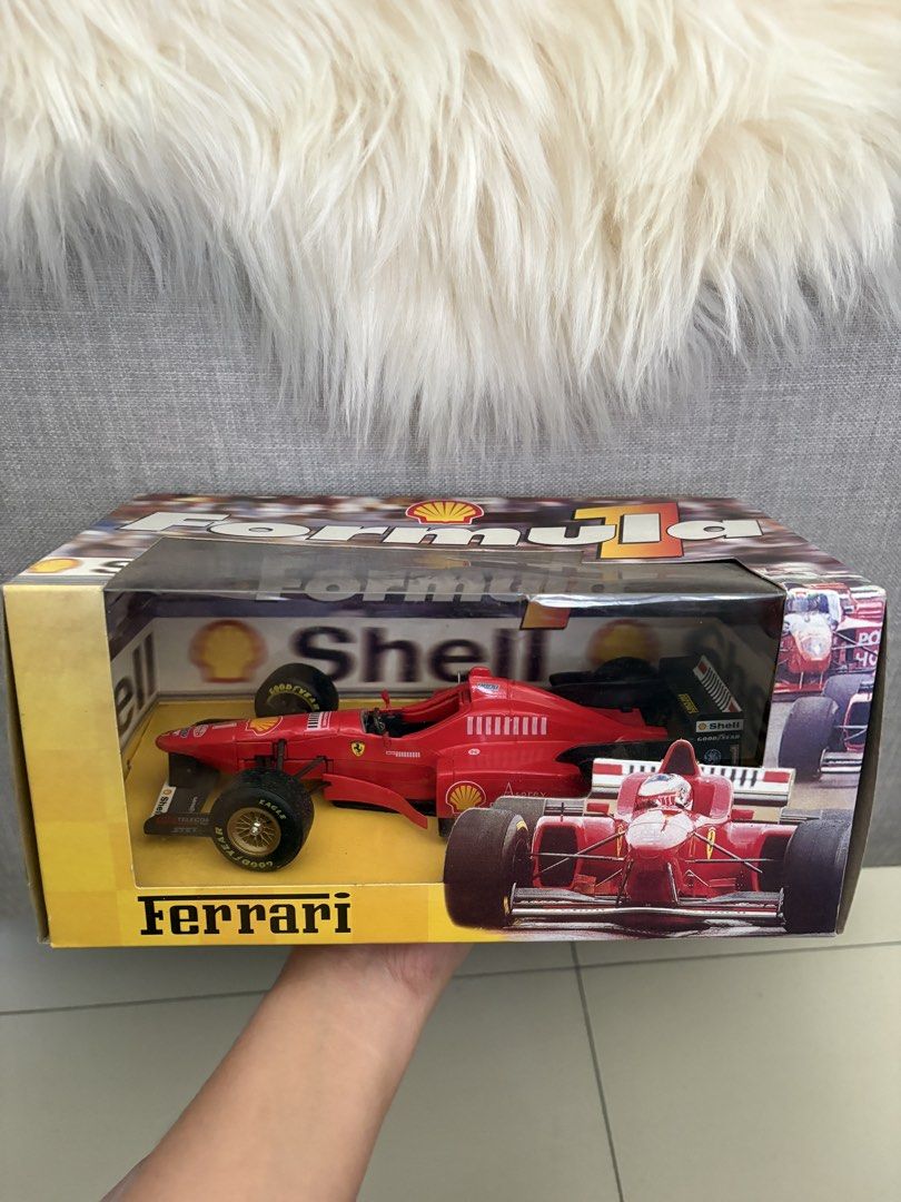 Shell Formula 1 Ferrari Michael Schumacher Diecast Model (Category: Vehicle & Diecast Models) located in Paranaque City. Submitted by craftywoobieph (Listing ID 1469803427, Image 1). Description: - Scale: Collectible Red Ferrari Formula 1 race car model - Edition: Rare Michael Schumacher edition - Packaging: Comes in an official Shell-branded display box with driver graphics - Condition: Great piece for collectors, with minor shelf wear around th